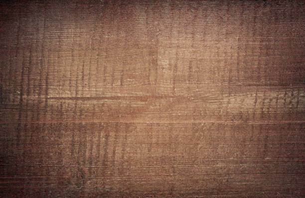 istock Brown scratched wooden cutting, chopping board. Wood texture. 871109028