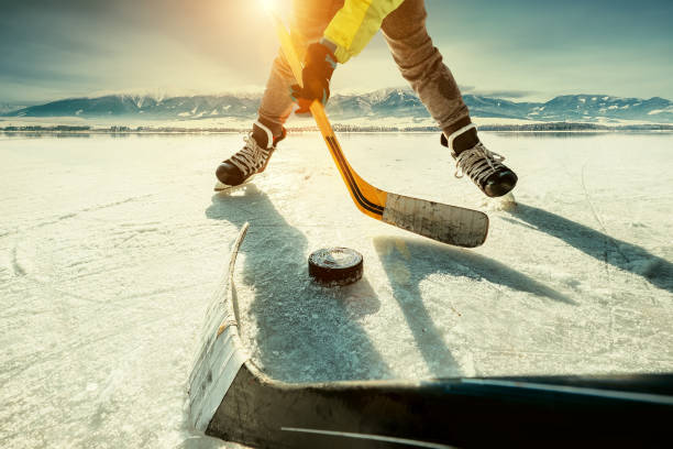 Ice hockey game moment Ice hockey game moment pond hockey stock pictures, royalty-free photos & images