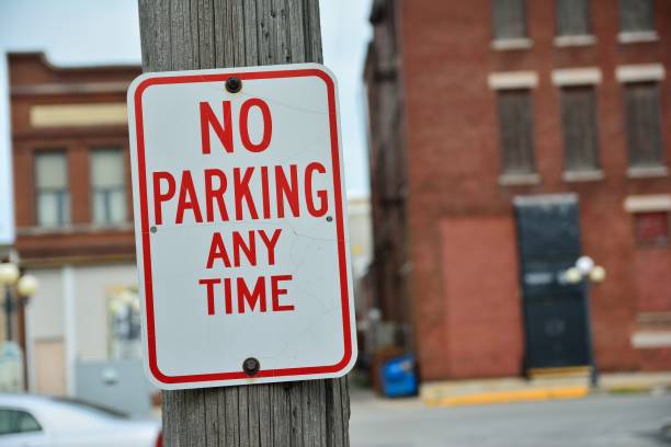 istock No Parking Any Time sign. 871112394