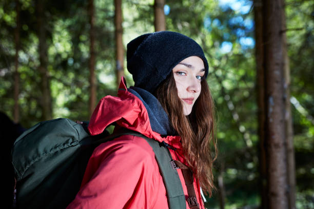 istock Woman embracing nature. Sunny day in forest 871114050