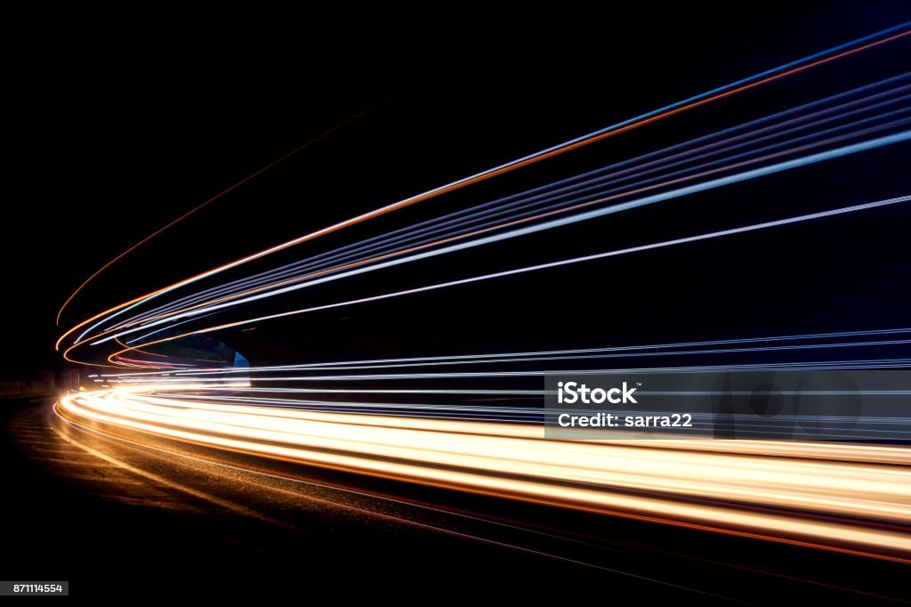 Car ligth trails. Art image Art image.Long exposure photo taken in a tunnel Lighting Equipment Stock Photo