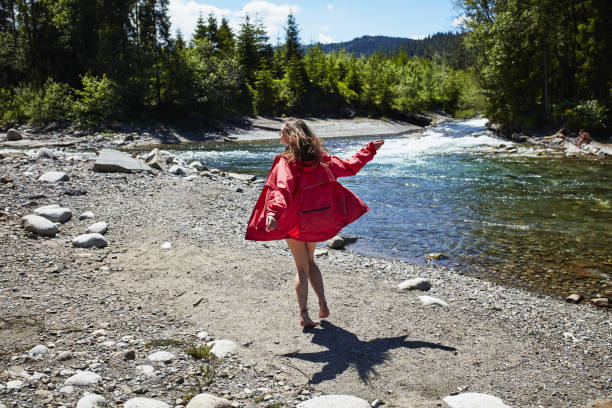 istock Young woman in the mountains. Embracing Nature 871114688