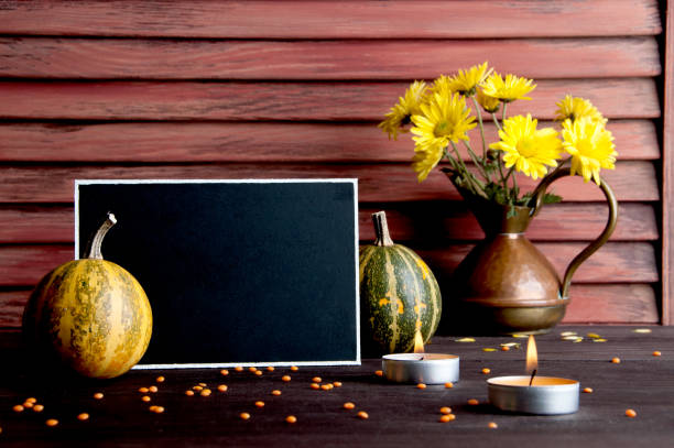 istock Black board, pumpkin and copper jug 871116540