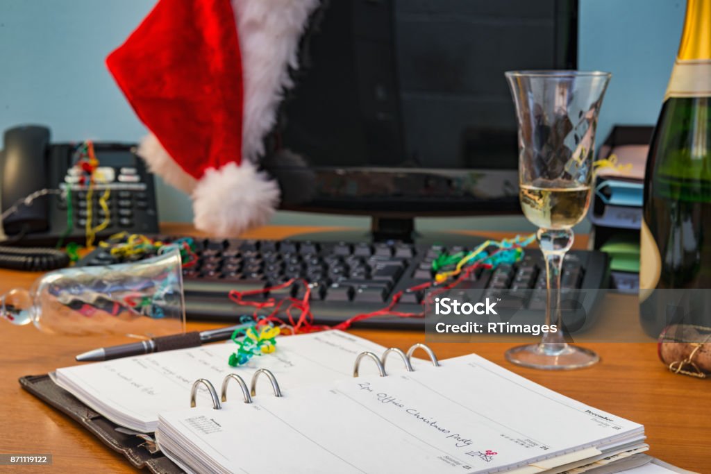 Office Christmas party A desk after the Ofiice Christmas party, focus on the diary entry. Christmas Stock Photo