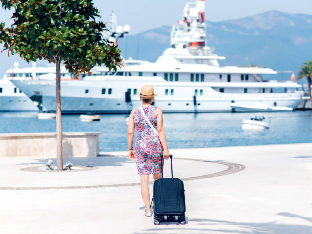istock Woman with suitcase getting ready for her trip 871119550