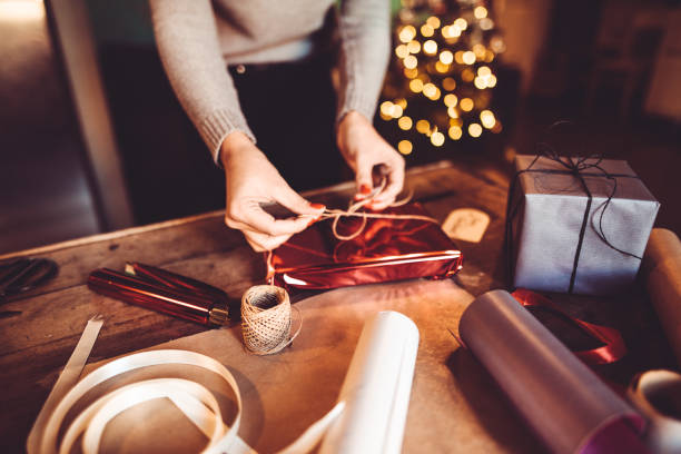 istock woman making the package for the christmas gift 871124188