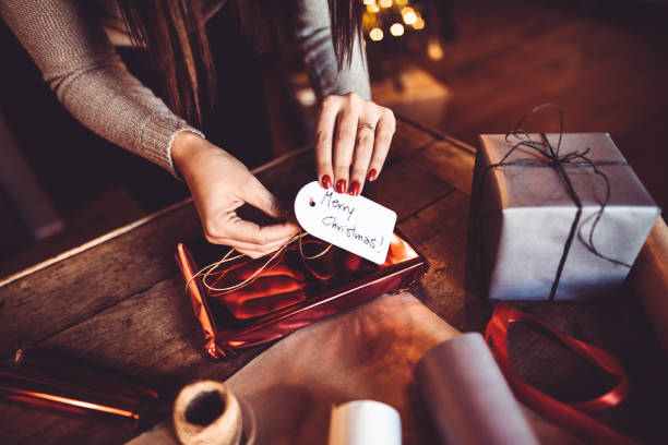 istock woman making the package for the christmas gift 871124312