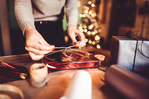 woman making the package for the christmas gift