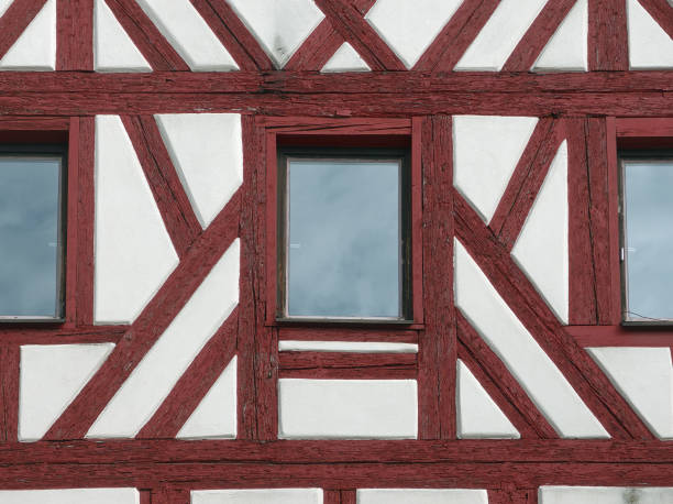 old window with geranium flower pot