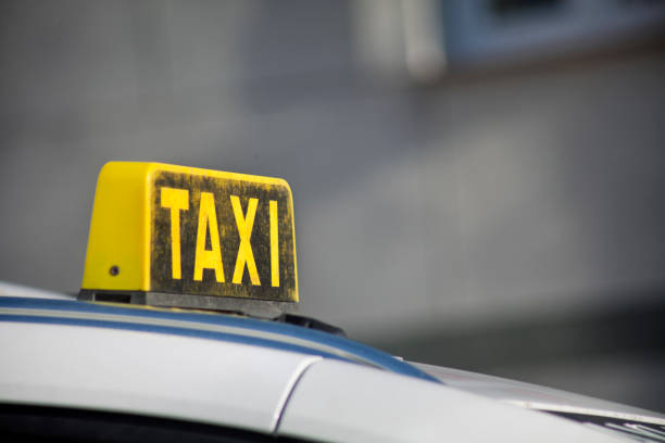 istock Taxi sign on car. 871125958