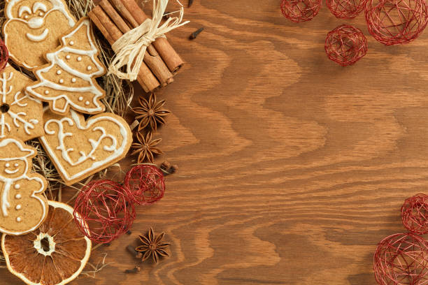 istock Christmas gingerbread on wooden background 871133324