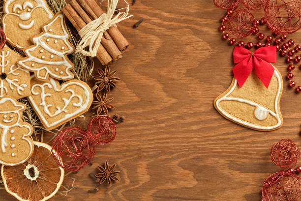 istock Christmas gingerbread on wooden background 871133336