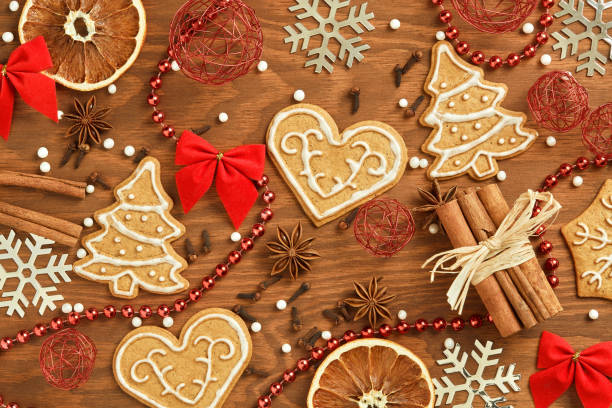 istock Christmas gingerbread on wooden background 871133432