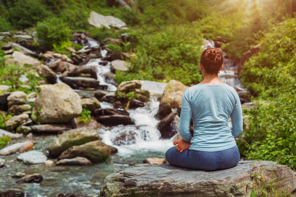istock Yoga outdoors - Padmasana asana lotus pose 871133536