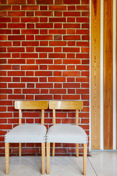 istock Building interior with wooden chairs and red brick wall. 871137274