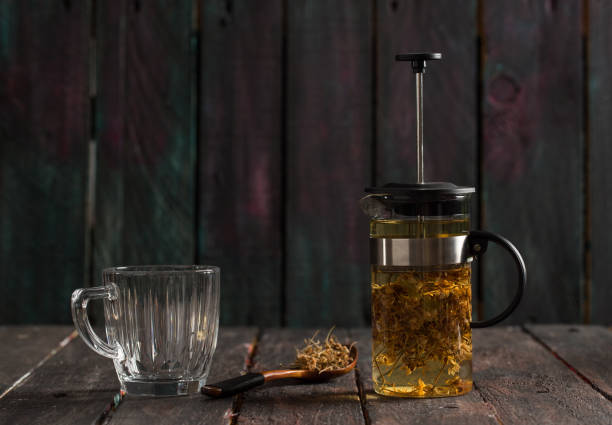 Hot Linden Tea and French Press on Table