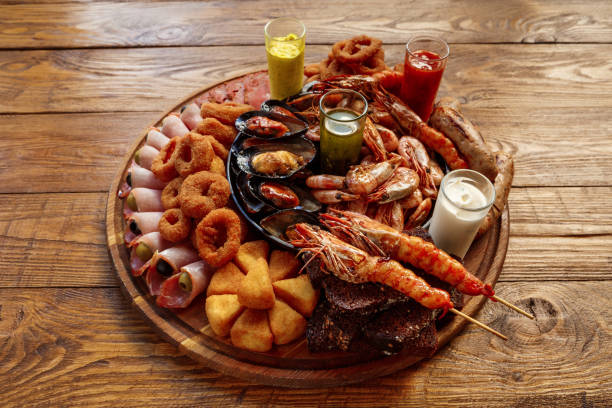 istock Seafood platter on wooden table background 871137840