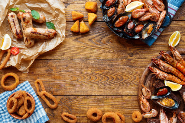 istock Seafood platter top view, flat lay on wooden table background 871137938