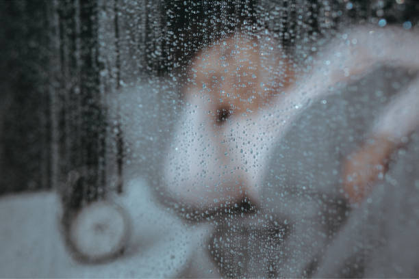 istock Close-up of window with raindrops 871141548
