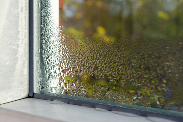 window with water drops closeup, inside, selective focus - condensation imagens e fotografias de stock