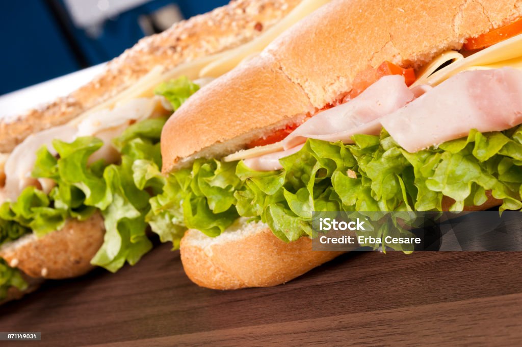 Sandwiches Sandwiches on the wooden table Baguette Stock Photo