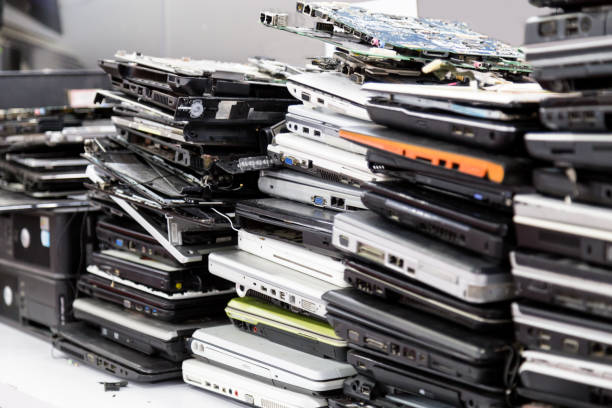 istock Stack of old, broken and obsolete laptop computer for repair 871149210
