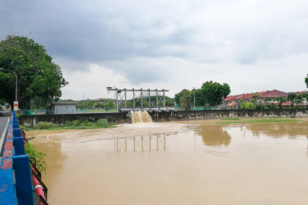 istock Rain water pumped into river from flood storm retention pond 871152616