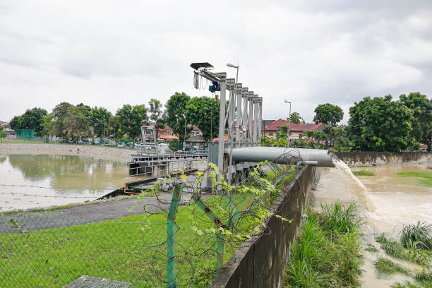 istock Rain water pumped into river from flood storm retention pond 871152646