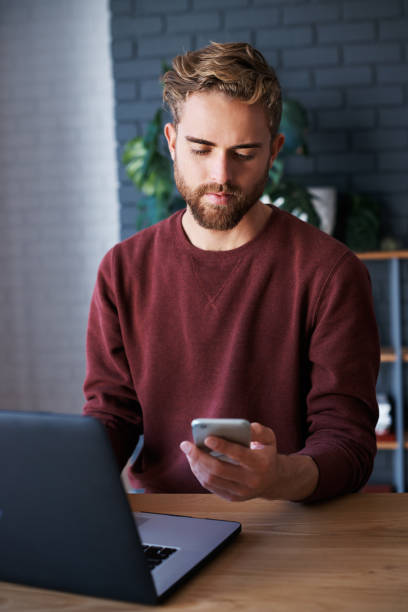 istock He's got the design brief on his smartphone 871153068