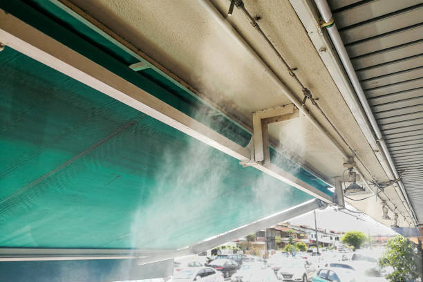 istock Water mist cooling system on ceiling lowers tropical ambient temperature 871153410
