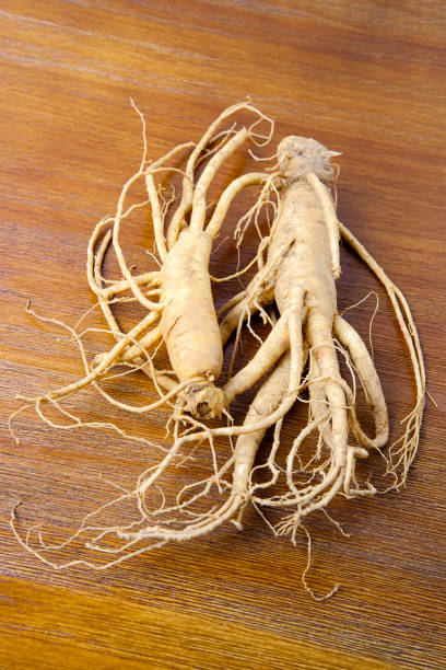 istock Korean fresh ginseng on wood background 871161166