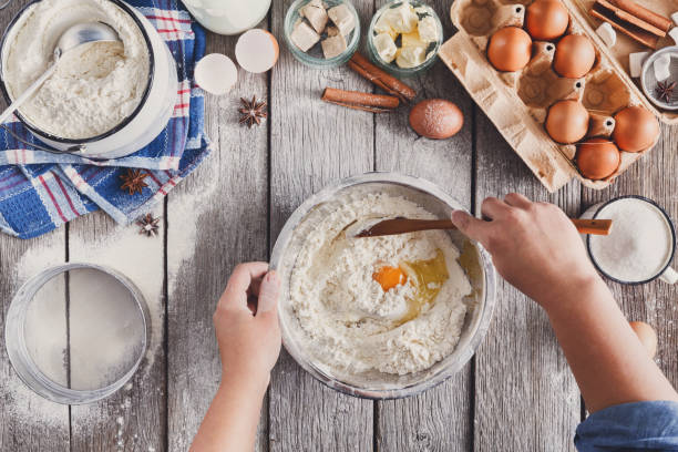 making dough top view on rustic wood background - baking flour ingredient animal egg imagens e fotografias de stock