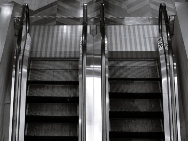 istock Top view of two way escalator in black and white 871162386