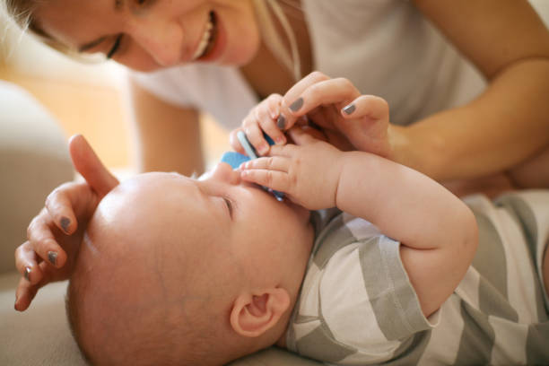 istock Mother playing with her baby boy. 871169032