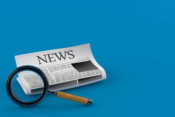 istock Newspaper with magnifying glass 871169338