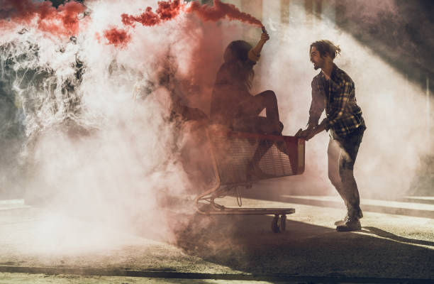 istock Two Young Teenagers Lighting a Smoke Flare 871172278