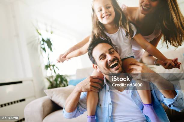 Happy Family Having Fun Times At Home Stock Photo - Download Image Now - Family, Happiness, Fun