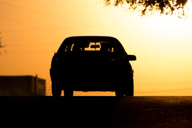 istock car rides on the road at sunset 871175810