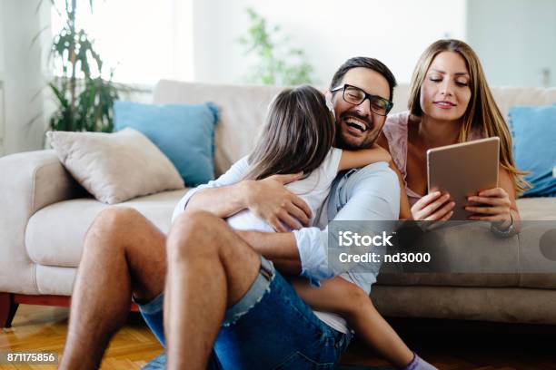 Happy Familiy Spending Fun Time At Home Stock Photo - Download Image Now - Family, Happiness, Digital Tablet