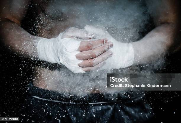 Hands Wrapped For Boxing Ready To Fight With Chalk Explosion Stock Photo - Download Image Now