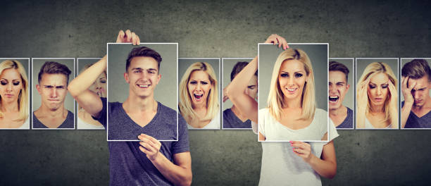 istock Balanced relationship concept. Masked woman and man expressing different emotions 871179876