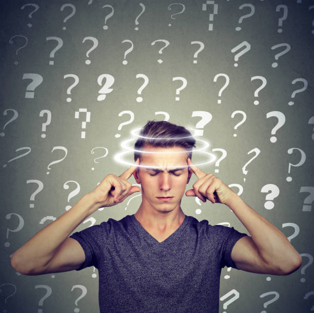 istock Portrait confused thinking young man with vertigo dizziness has many questions 871179990