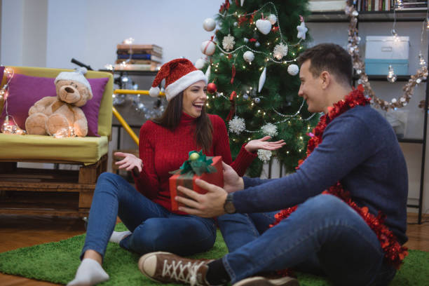 istock Giving her a Christmas gift 871180292