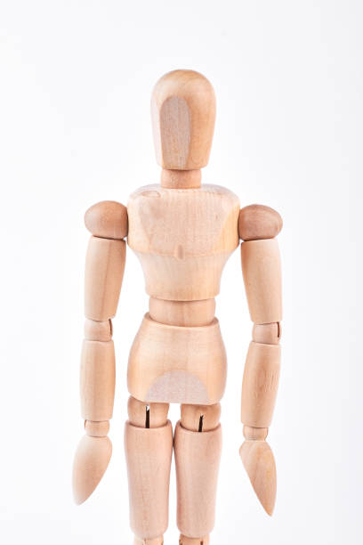 istock Human wooden dummy standing over white. 871180416
