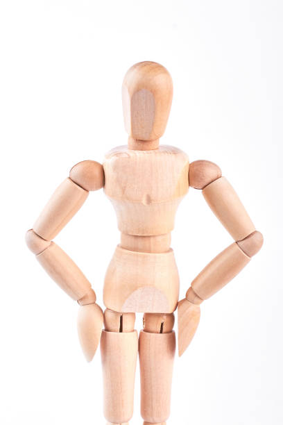 istock Wooden dummy with hands on hips. 871180752