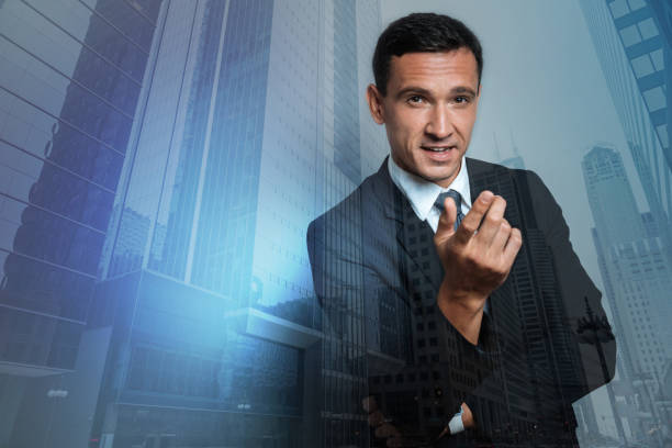 istock Nice confident businessman looking at you 871181370
