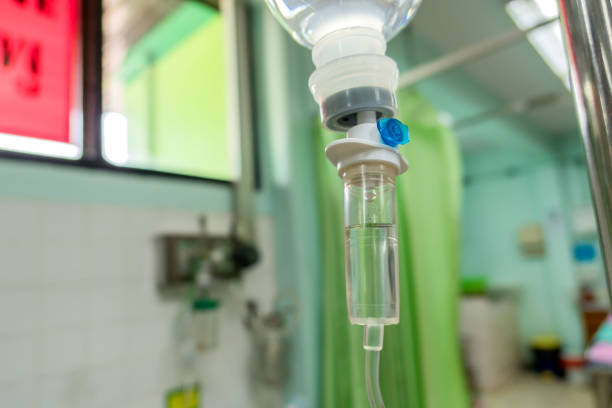 istock Close up  IV saline solution drip for patient hospital 871182532