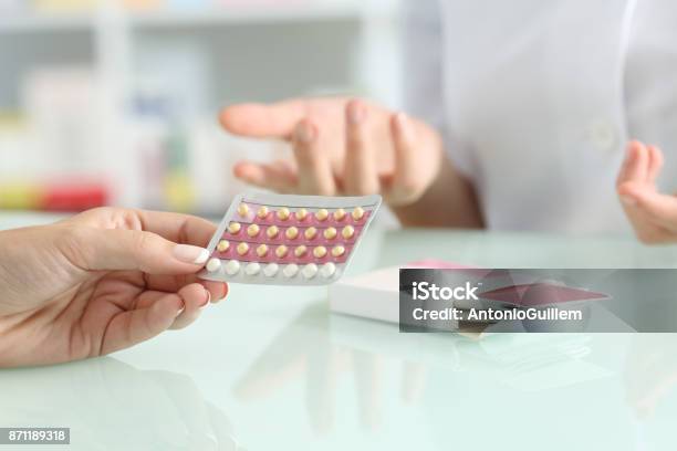 Girl Buying Contraceptive Pills In A Pharmacy Stock Photo - Download Image Now - Contraceptive, Birth Control Pill, Sex Education