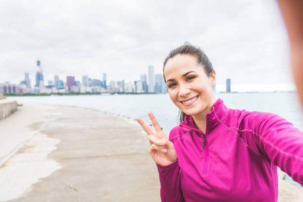 istock Woman taking a selfie after workout in Chicago 871195682