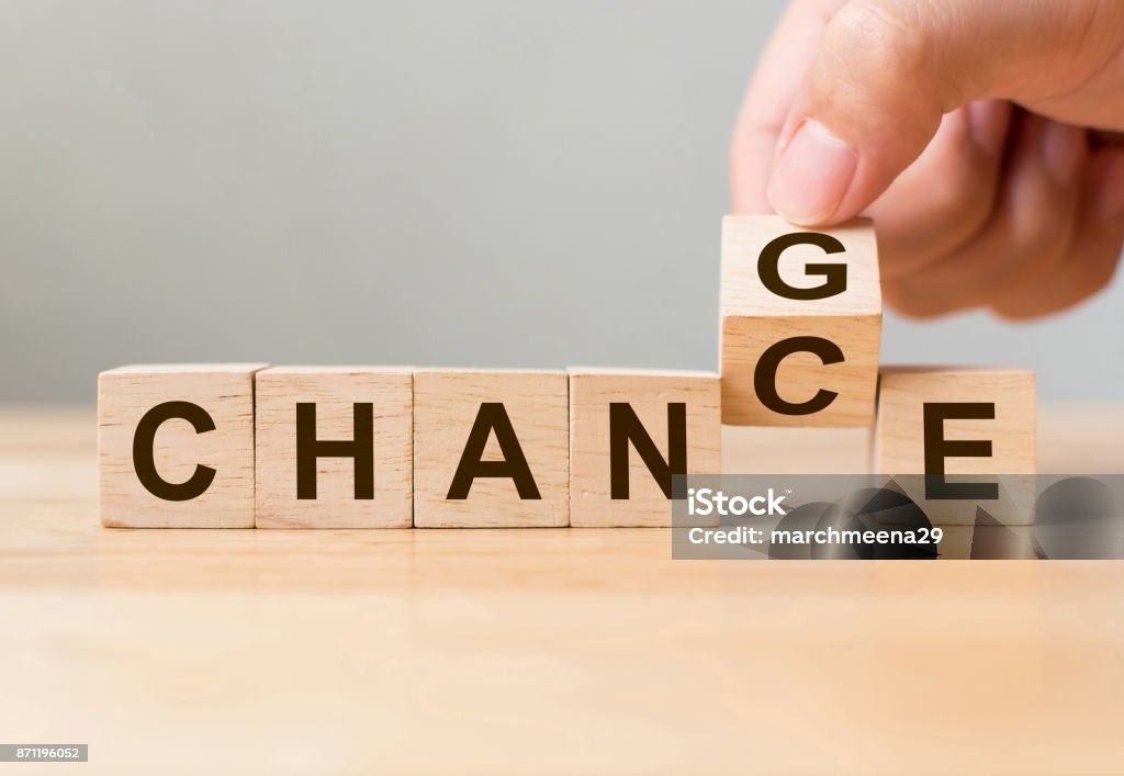 Hand flip wooden cube with word "change" to "chance", Personal development and career growth or change yourself concept Change Stock Photo